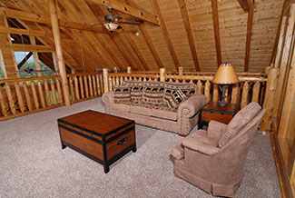 Lofted area seating room with amountain view